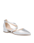 Silver shimmer pointed-toe court shoe with crossover straps and low block heel, angled view