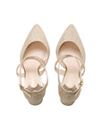 Pair of champagne glitter shoes with pointed toes and adjustable ankle straps, top view