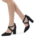 Model wearing Gwendolyn black wide fit block heel shoes with cross straps