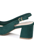 A dark green suede slingback high heel shoe with a block heel, open toe, and a gold-tone metal buckle on the ankle strap, shown from a side profile view against a white background.