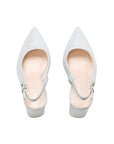 Pair of silver glitter slingback shoes with pointed toes, top view