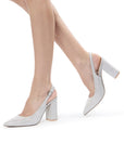 Model wearing Irisa silver glitter block heel shoes with adjustable slingback straps