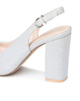 Close-up of the silver glitter block heel and adjustable slingback buckle