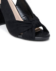 Close-up of Magda black sandal with knotted front strap