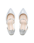Pair of silver shimmer pointed-toe court shoes with crossover straps, top view