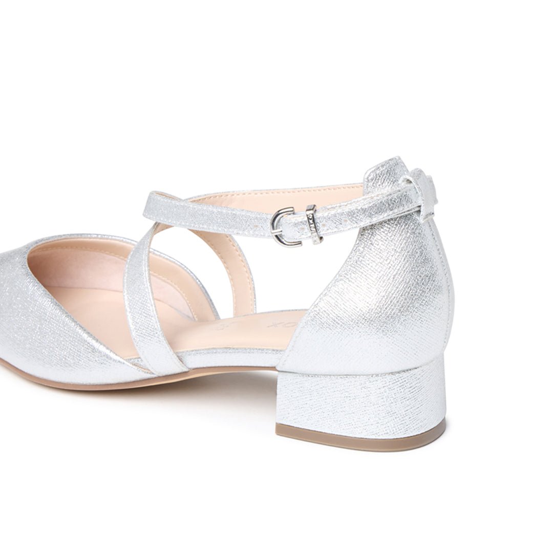 Close-up of the adjustable buckle, crossover straps and low block heel