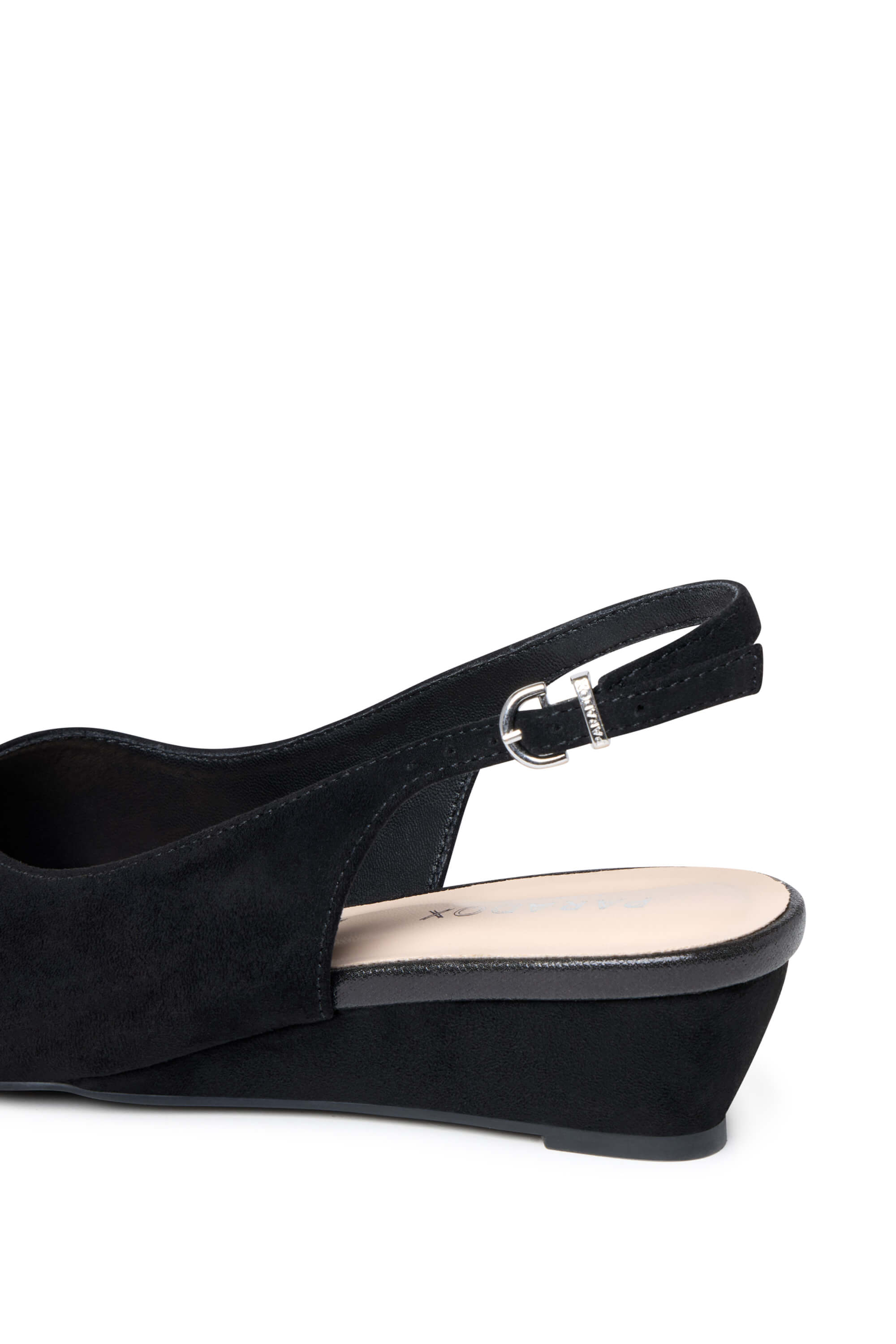 A close-up side view of a black wedge slingback sandal with a suede-like finish and a silver-tone buckle, shown on a plain white background.