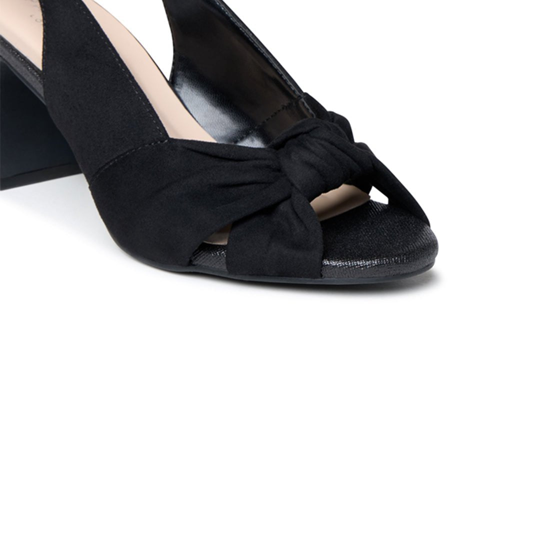 Close-up of the knotted front, open toe and black microsuede upper