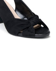 Close-up of the knotted front, open toe and black microsuede upper