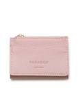 A light pink textured leather card holder wallet with a gold zipper pull and debossed 'PARADOX LONDON' branding, shown on a clean white background.