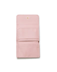 A light pink leather wallet shown open against a plain white background, displaying its interior card slots and a small gold-tone snap button at the top.