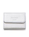 A silver textured leather wallet with a flap closure, featuring the debossed brand name 'PARADOX LONDON' on the front, set against a plain white background.